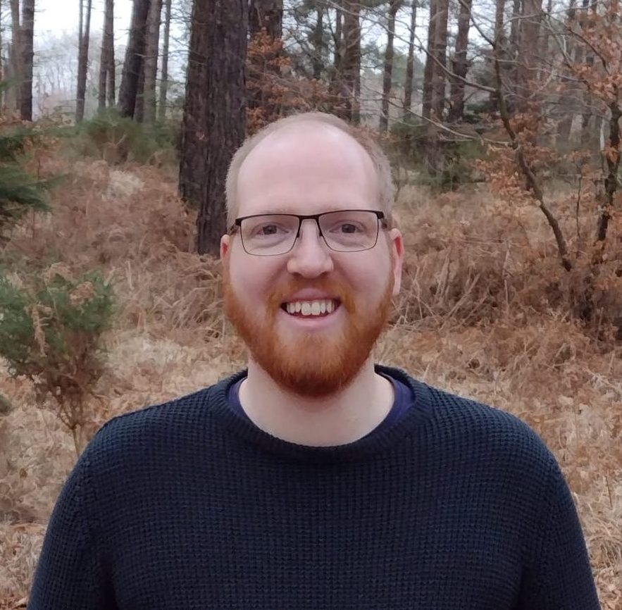 Anthony, a freelance WordPress developer, outdoors in woodland